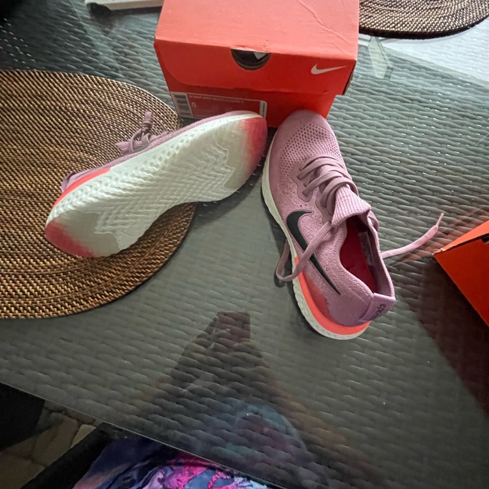 Woman’s Nike Epic React Flynit 2 sneakers.   Brand new in box.  Size 8